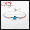 platinum plated bracelet with blue oval glass pandent